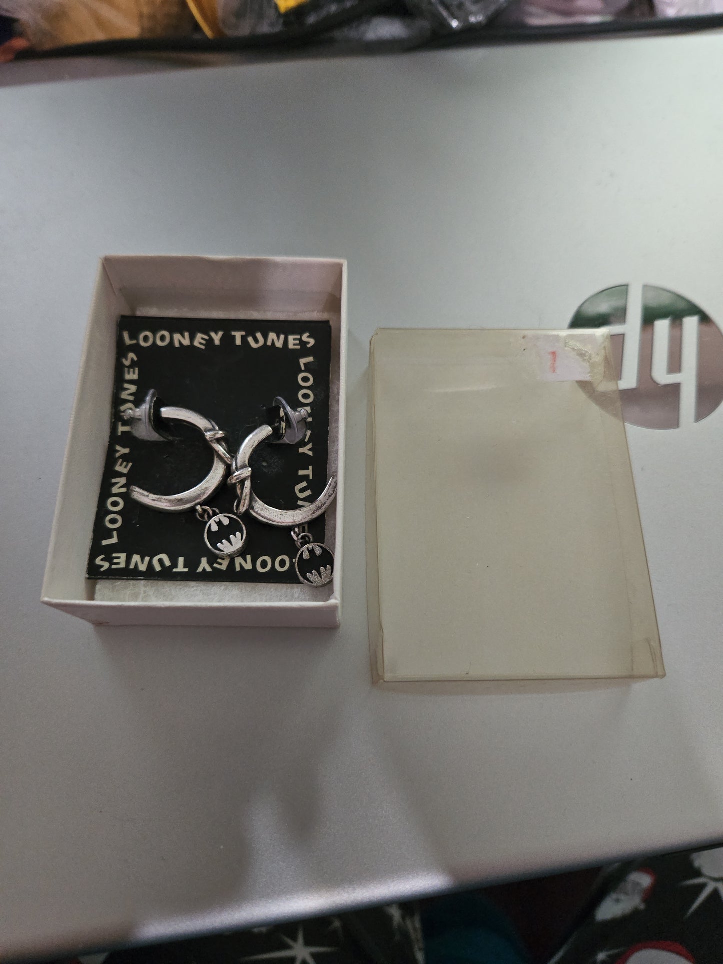 Vintage Batman Base Metal earring in original box of utility belt