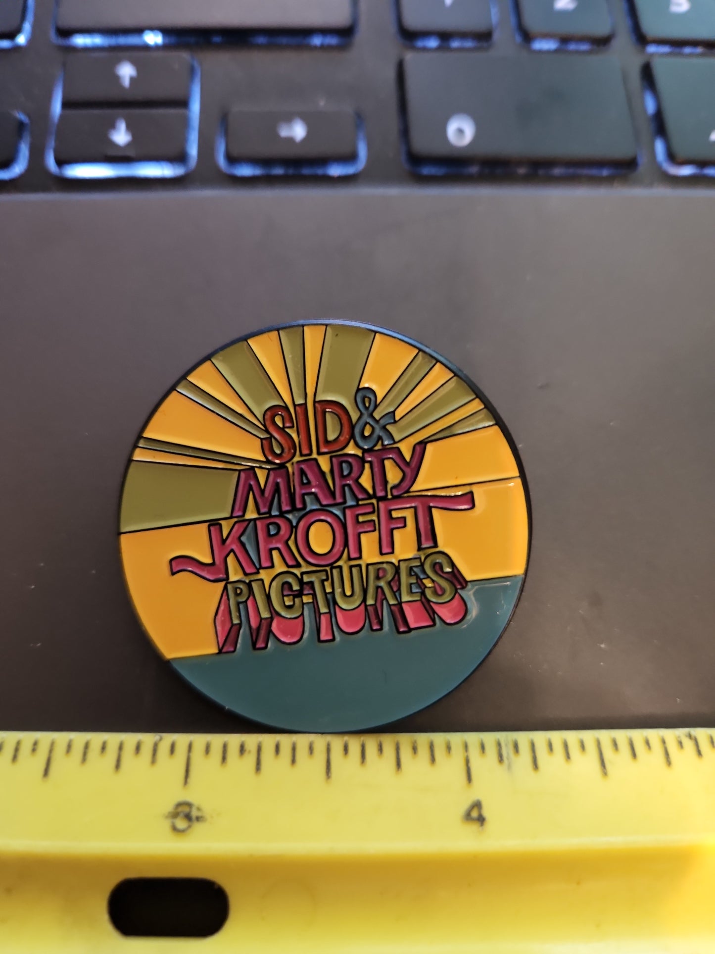 Sid & Marty Krofft Pictures Employee Pin - Enamel Pin Roughly 1.5 inch Round